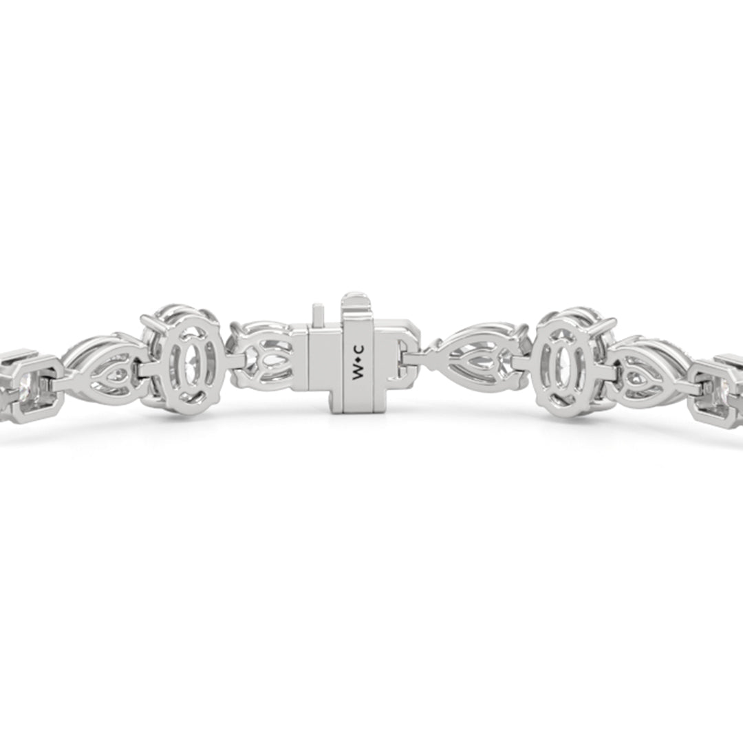 Pear Oval Sequenced with Bezeled Emerald Tennis Bracelet - Lotus Diamond