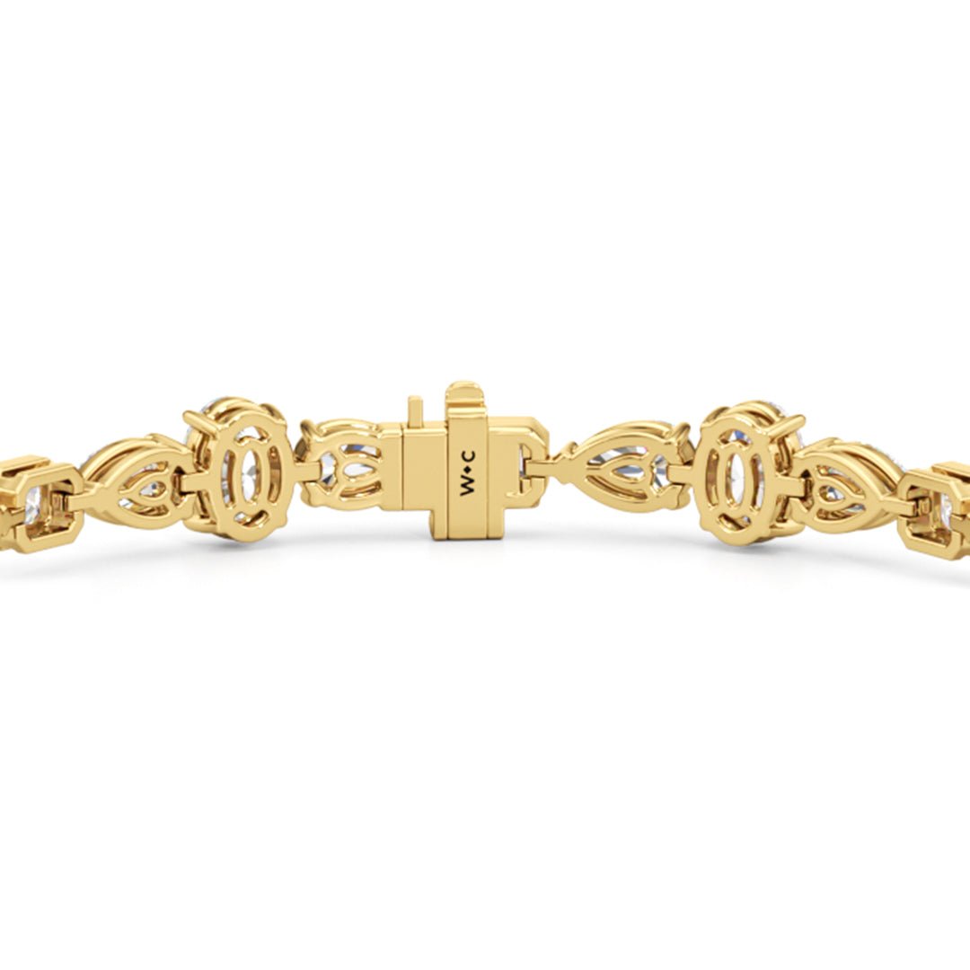 Pear Oval Sequenced with Bezeled Emerald Tennis Bracelet - Lotus Diamond