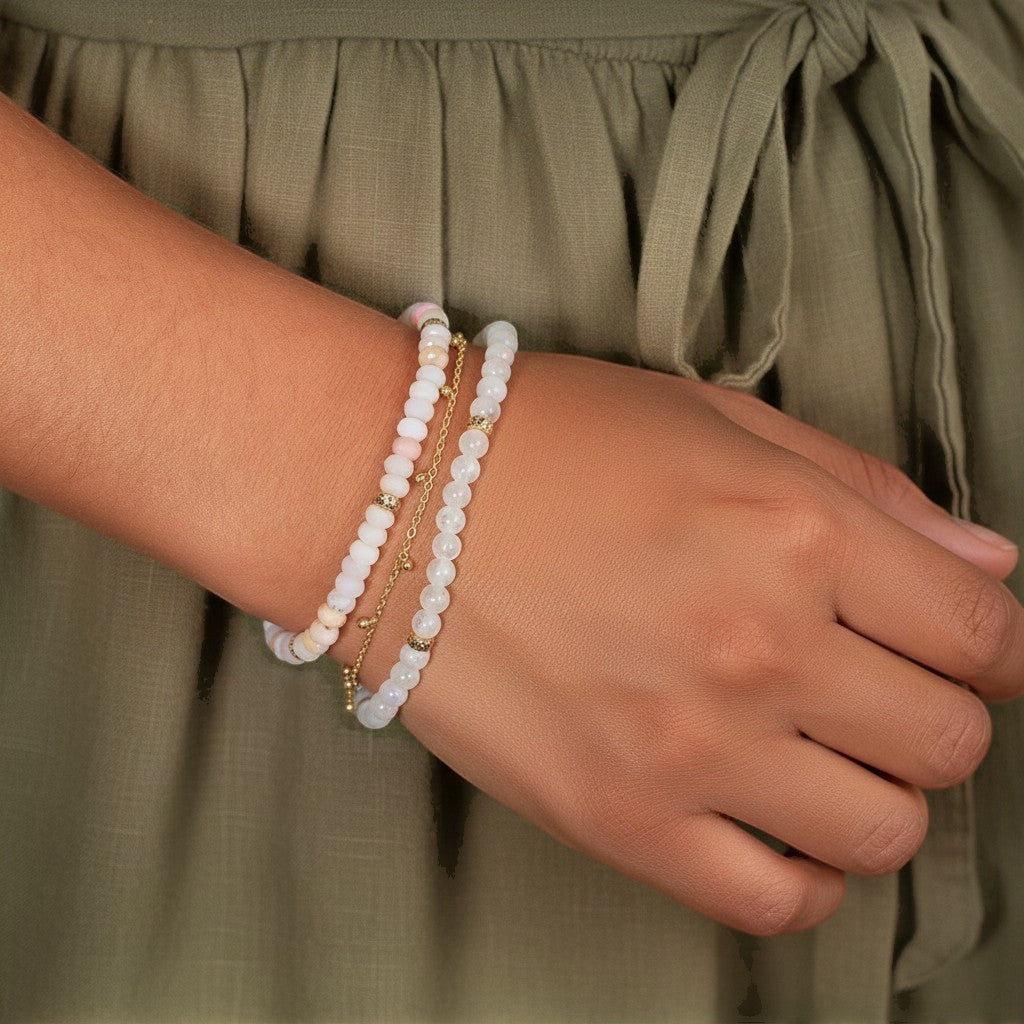 Lotus Diamond dainty ball chain bracelet with small white beads and gold accents on a child's wrist.