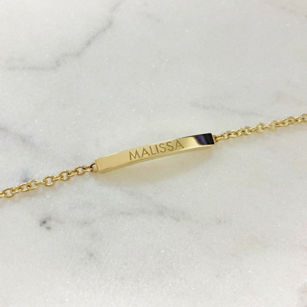Lotus Diamond gold bar bracelet engraved with 'CATHERINE'. Made from 100% recycled gold.