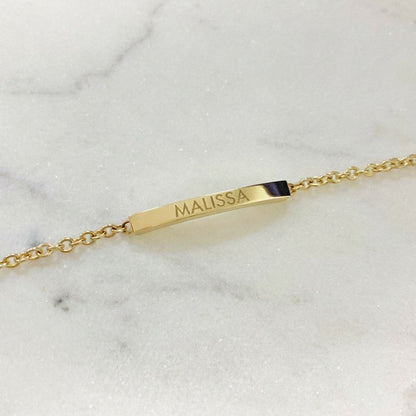 Lotus Diamond gold bar bracelet engraved with 'CATHERINE'. Made from 100% recycled gold.