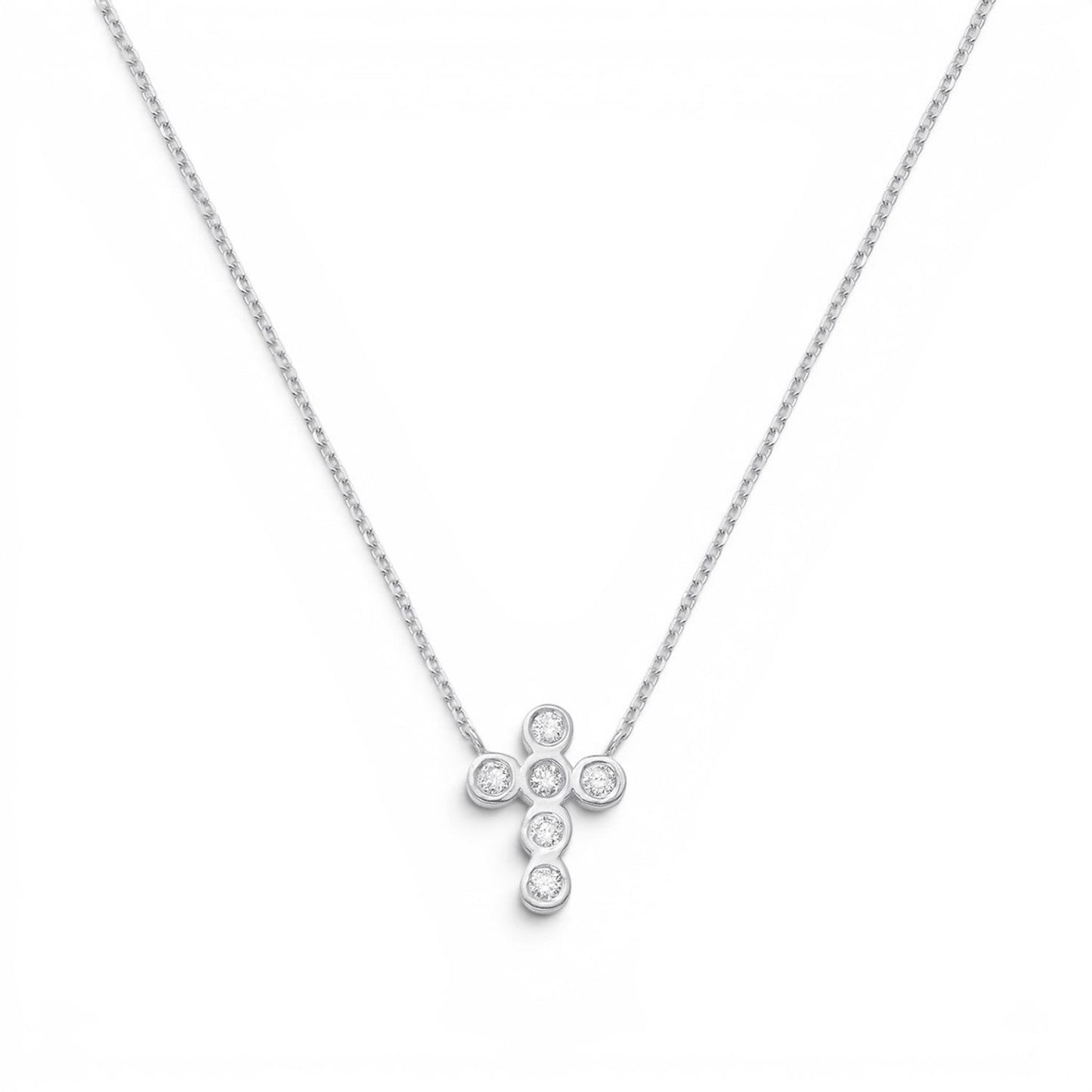 Lotus Diamond Kids 14K solid gold cross necklace with 0.10ct diamonds on a delicate chain.