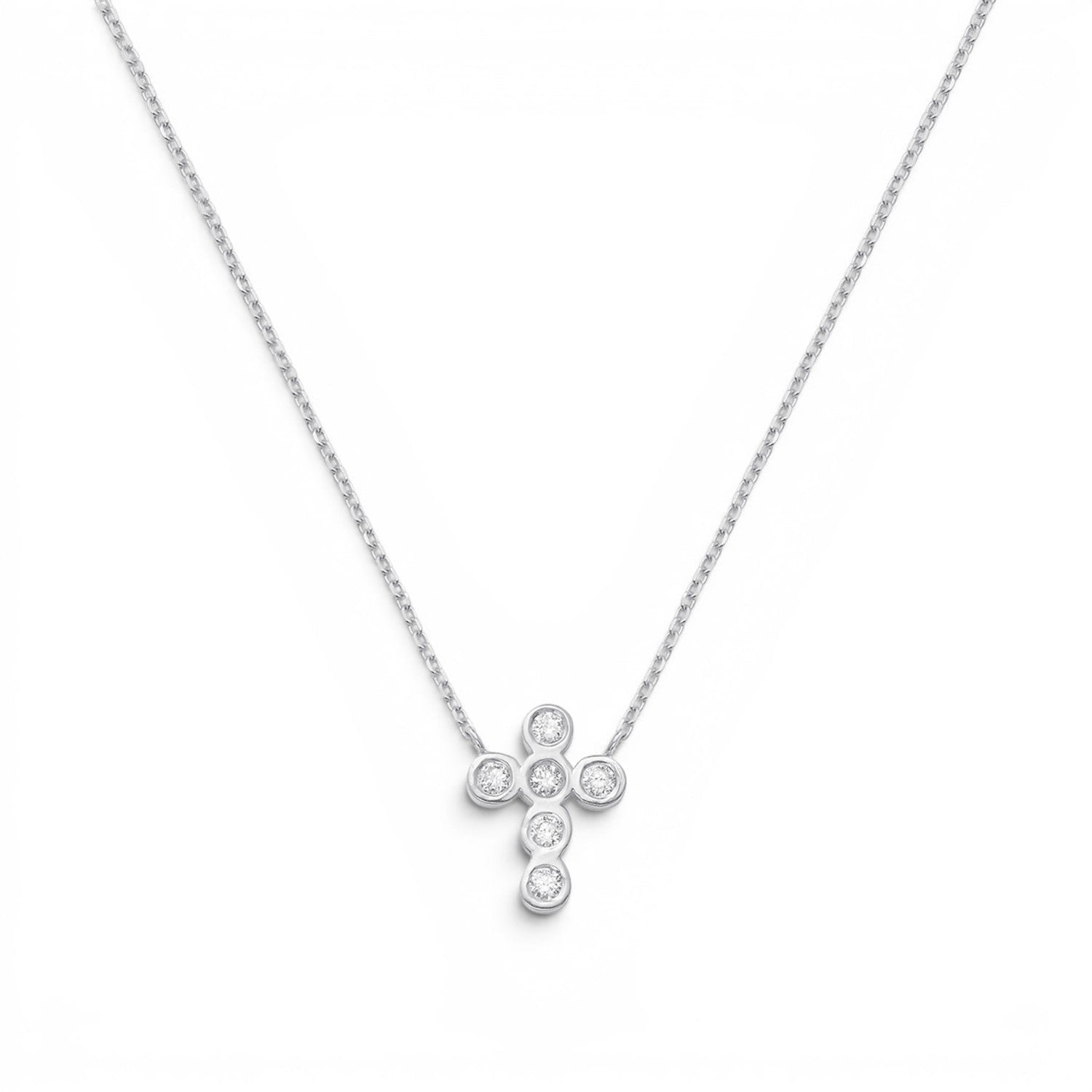 Lotus Diamond Kids 14K solid gold cross necklace with 0.10ct diamonds on a delicate chain.