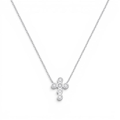 Lotus Diamond Kids 14K solid gold cross necklace with 0.10ct diamonds on a delicate chain.