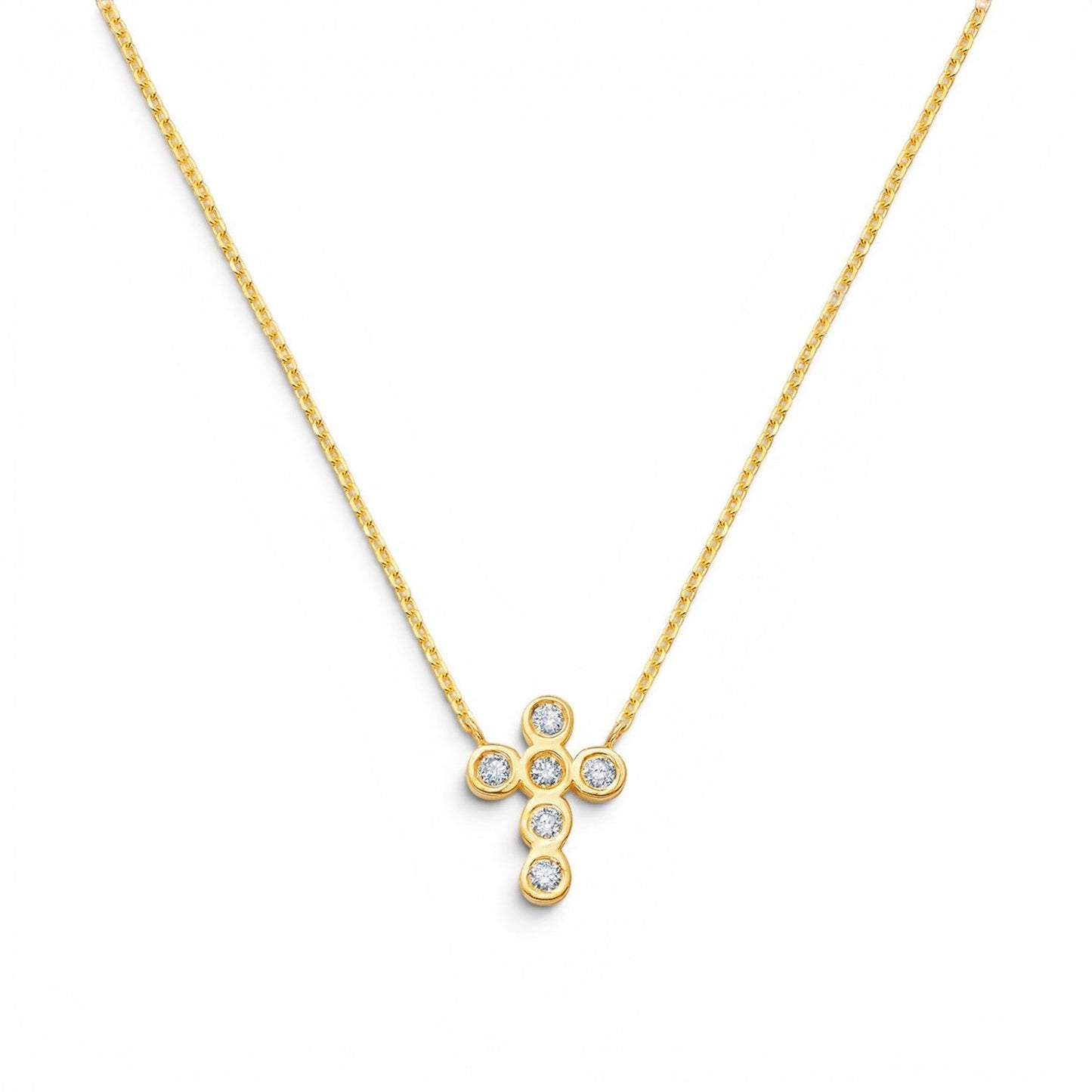 Lotus Diamond Kids 14K gold cross necklace with bezel-set diamonds. Delicate chain.