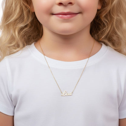 Lotus Diamond 14k gold cursive custom name necklace for kids, shown on a young girl wearing a white t-shirt.