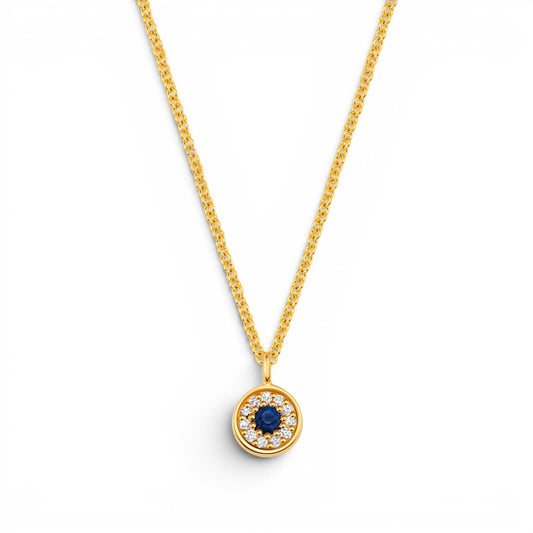Lotus Diamond Kids Dainty Round Evil Eye Necklace with sapphire and diamonds on a 14kt gold chain.