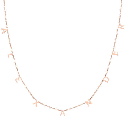 Lotus Diamond rose gold mini spaced letter necklace spelling "ALEXANDER". Dainty, personalized, sustainable, recycled gold.