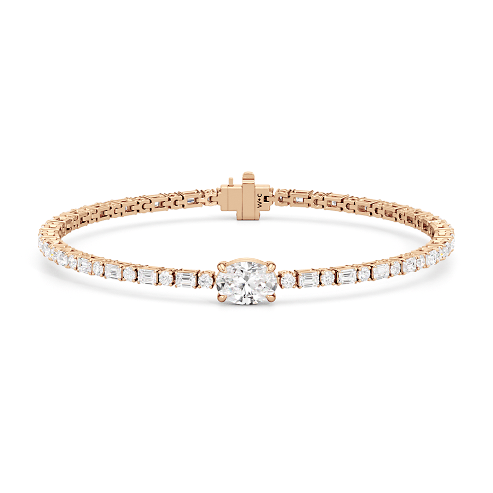 Oval with Trailing Round and Emeralds Tennis Bracelet - Lotus Diamond