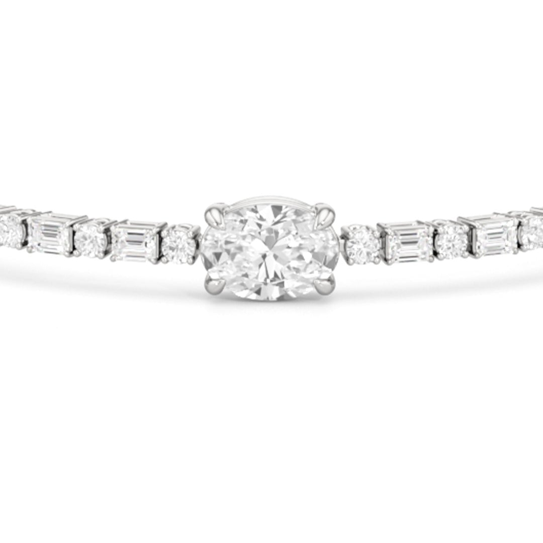 Oval with Trailing Round and Emeralds Tennis Bracelet - Lotus Diamond