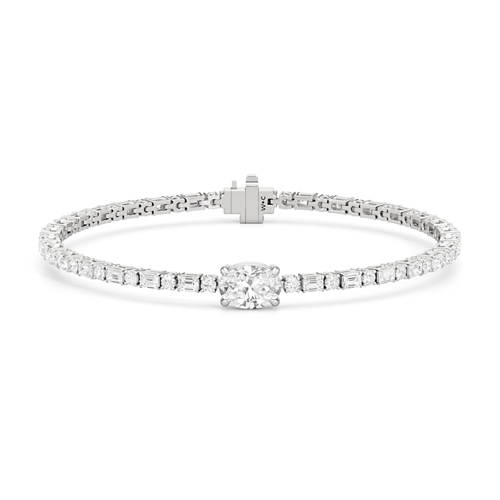 Oval with Trailing Round and Emeralds Tennis Bracelet - Lotus Diamond