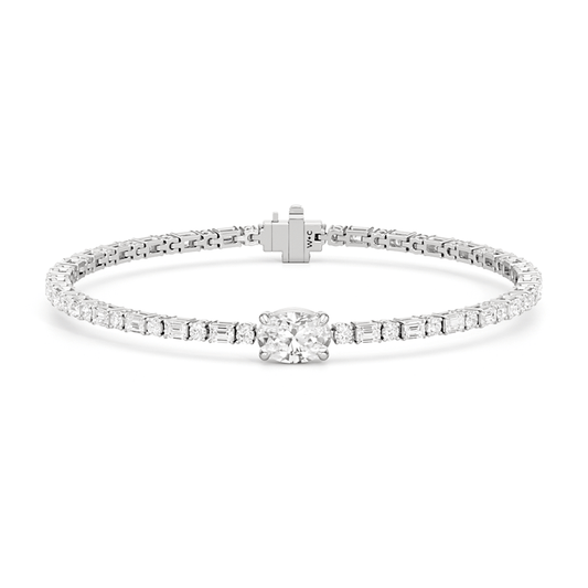 Oval with Trailing Round and Emeralds Tennis Bracelet - Lotus Diamond