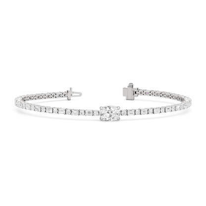 Oval with Trailing Round and Emeralds Tennis Bracelet - Lotus Diamond