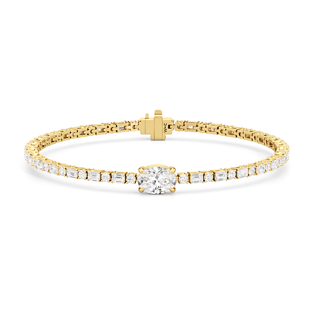 Oval with Trailing Round and Emeralds Tennis Bracelet - Lotus Diamond